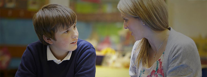 Boy lip-reading his teacher