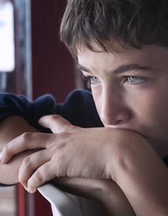 Boy looking out of a window