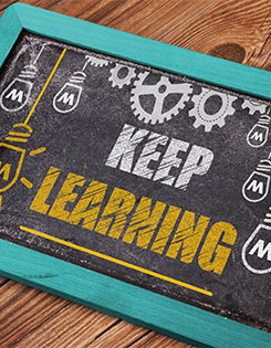 Chalkboard with keep learning written on it