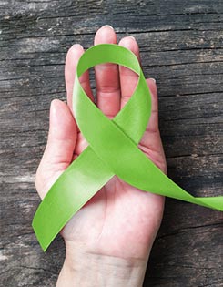 Green ribbon celebrating Children's Mental Health Week.