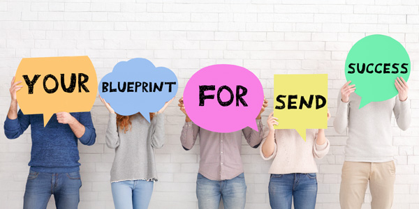 People holding sign up spelling out Your Blueprint for SEND Success